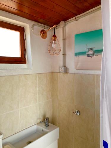 a bathroom with a bath tub and a sink at Rincón del Mar , Espacio Natural in La Orotava