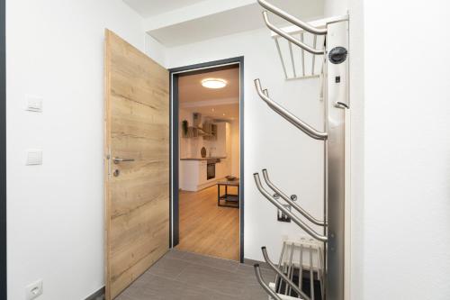 a hallway with a door leading into a room at Souterrain Apartment Flachau in Flachau