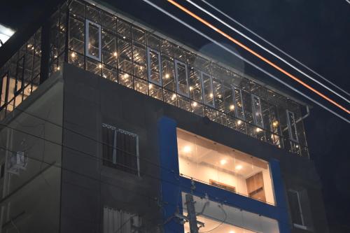 a building with lights on the side of it at Hotel La Vista Inn in Tinsukia