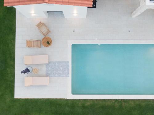 an overhead view of a swimming pool in a house at Ionian Trilogy Luxury Villas in Sami