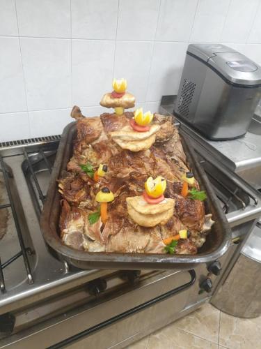 a pan filled with food on top of a stove at Safi in Dospat