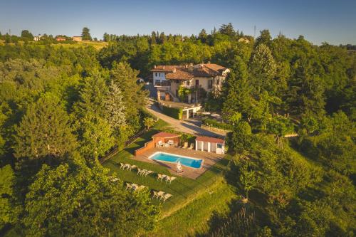 an aerial view of a house with a swimming pool at Villa La Meridiana in Alba