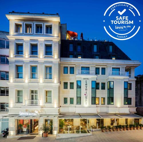 una representación de un edificio blanco con las palabras que ella turismo en Levni Hotel & SPA - Special Category, en Estambul