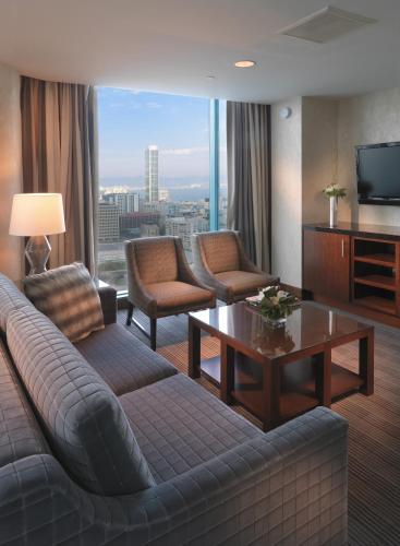 a living room with a couch and a table at InterContinental San Francisco by IHG in San Francisco