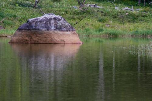 a large rock in the middle of a body of water at Hacienda Siete Sentidos in La Mesa