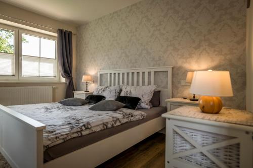 Postel nebo postele na pokoji v ubytování Ferienwohnung Heide View