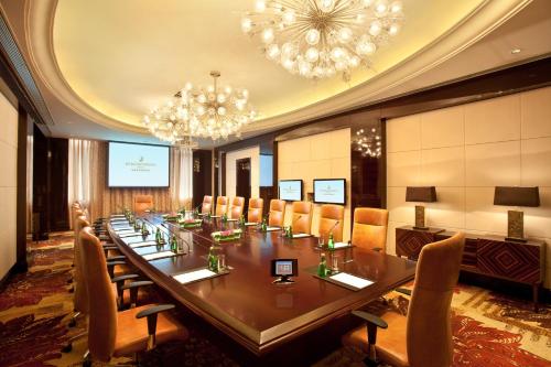 a large conference room with a long table and chairs at InterContinental Wuxi by IHG in Wuxi