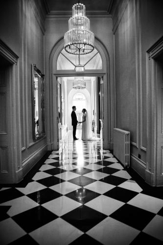 a bride and groom standing in a hallway at The Milner York in York