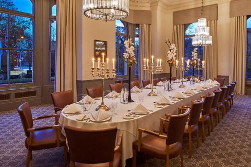 a long dining room with a long table and chairs at The Milner York in York
