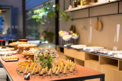 a buffet line with sandwiches and other food items at Hotel Indigo Larnaca by IHG-ADULTS ONLY in Larnaka