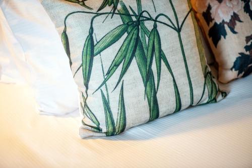 a pillow sitting on top of a bed at Hotel Indigo Brussels - City by IHG in Brussels