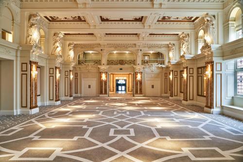 an ornate hallway with a large tile floor in a building at Kimpton Fitzroy London by IHG in London