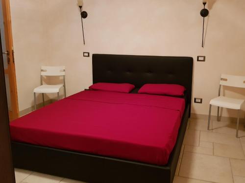 Кровать или кровати в номере Il Piccolo Gioiello