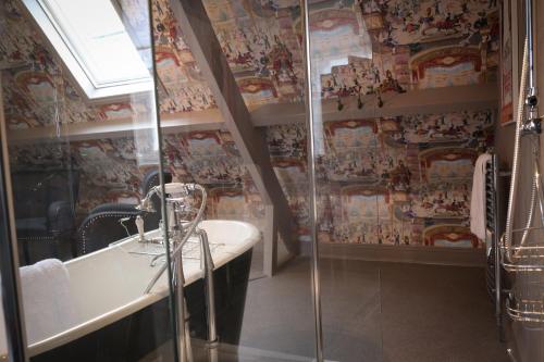a bathroom with a shower and a sink at Brockley Hall Hotel in Saltburn-by-the-Sea