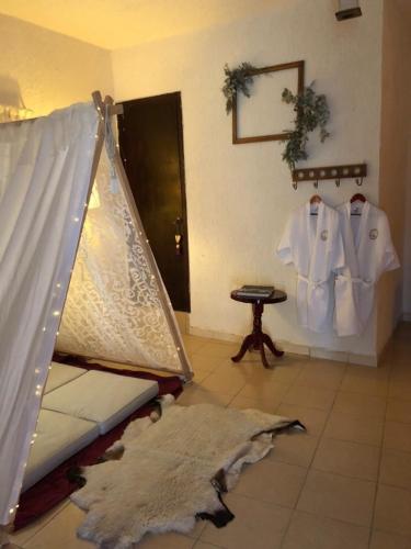 Ένα ή περισσότερα κρεβάτια σε δωμάτιο στο Hotel Boutique Calderon