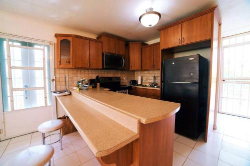 Virtuvė arba virtuvėlė apgyvendinimo įstaigoje Casa Peace Haven Beach House Aguada