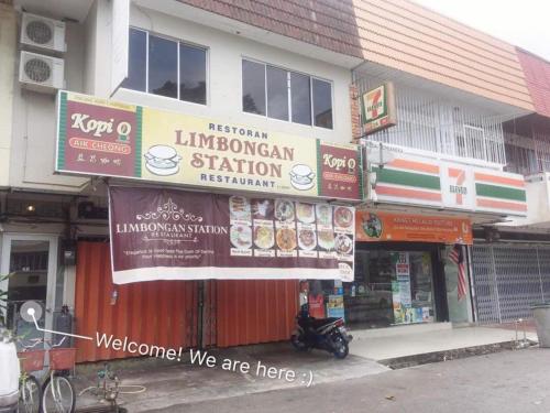 a store with signs on the front of a building at Once In Peninsula Guesthouse by Nestcove in Melaka