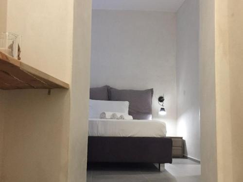 Postel nebo postele na pokoji v ubytování Vicoli di Napoli B&B