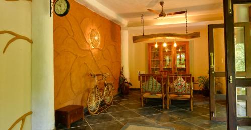 a hallway with a room with a bike on the wall at Beyond Eco Living in Munnar
