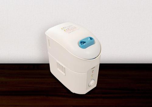 a wii controller sitting on top of a table at Hotel Trend Fukuyama Ekimae in Fukuyama
