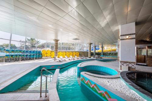 a swimming pool at a resort with a water park at The Week & Resort in Incheon