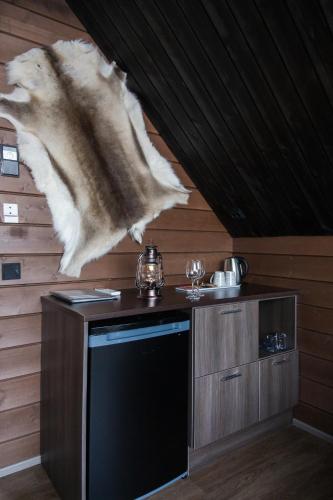 a fish is hanging from the ceiling of a room at Holiday Village Inari in Inari