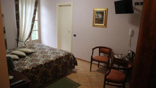 Katil atau katil-katil dalam bilik di La Regibussa - Hotel Ristorante