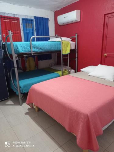 Ένα ή περισσότερα κρεβάτια σε δωμάτιο στο Hotel Casa Ceci Inn