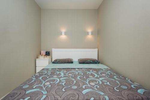 a bedroom with a large bed with two pillows on it at Apart-hotel I. Sirko New Building 2 floor in Sumy