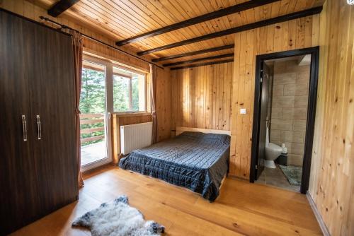 Un pat sau paturi într-o cameră la Vila Zen