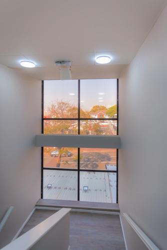 an empty room with a view of a window at Florida Park Hotel, Florida Road in Durban