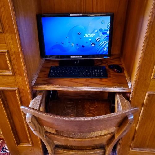 a laptop computer sitting on top of a desk at James Bay Inn Hotel, Suites & Cottage in Victoria