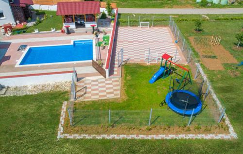 an aerial view of a playground with a pool at Vila NINA in Gospić