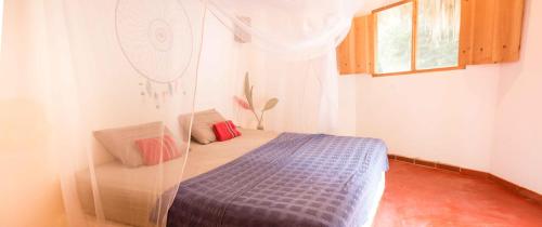 Een bed of bedden in een kamer bij Finca Carpe Diem Ecolodge