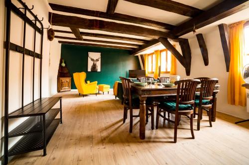 a dining room with a table and chairs at Résidence des Tanneurs - Sylvaner in Obernai