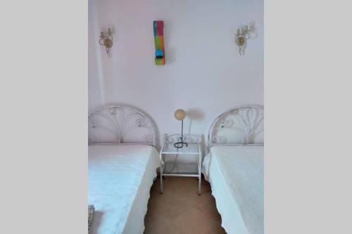En eller flere senger på et rom på Casa do Avô