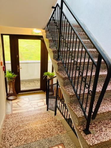 a stairway with a glass door and aoyer with a stair at Na Kamieńcu in Czarny Dunajec