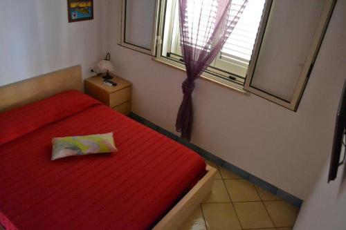 מיטה או מיטות בחדר ב-Graziosa villetta stile dammuso