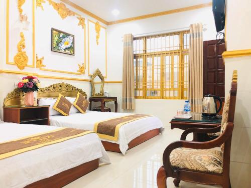 Posteľ alebo postele v izbe v ubytovaní King Hotel Quang Ngai