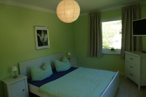 Łóżko lub łóżka w pokoju w obiekcie Stadtvilla Sommerfrische