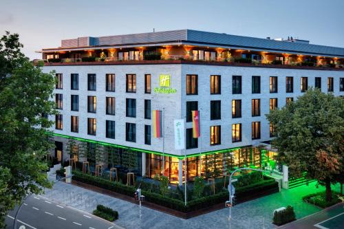 an overhead view of a building with lights on at Holiday Inn - Osnabrück by IHG in Osnabrück