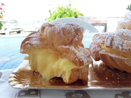 a plate with three pastries on a table at Covo dei Marinai in Cava dʼAliga