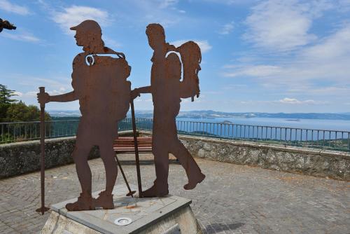 a statue of two people walking on a bridge at Alloggio Turistico Centro Storico Malatesta in Montefiascone