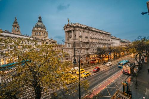 a view of a city street with cars and buildings at ENZO CAPO VIP suite in Budapest