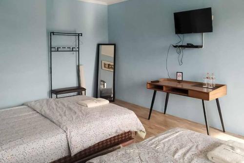 Postel nebo postele na pokoji v ubytování Kampung Abdi Resort Syariah Mitra RedDoorz