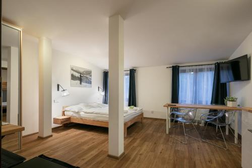 Postel nebo postele na pokoji v ubytování Hotel U Kabinky