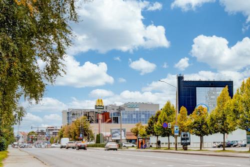 a city street with cars driving down a road at Aura, City Center, Tartu Home in Tartu