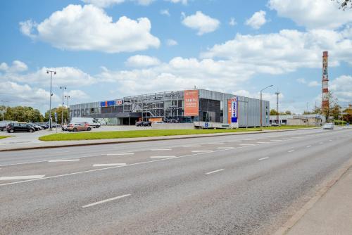 a large building on the side of a road at Aura, City Center, Tartu Home in Tartu