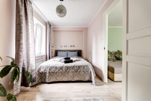 a bedroom with a bed and a window at Aura, City Center, Tartu Home in Tartu