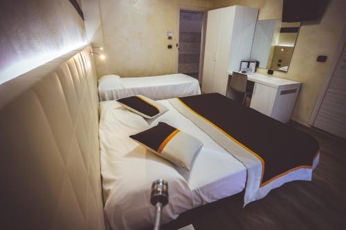 Ένα ή περισσότερα κρεβάτια σε δωμάτιο στο Hotel City